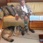 German Shepherd with man on couch