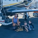 Family with German Shepherd and Plane