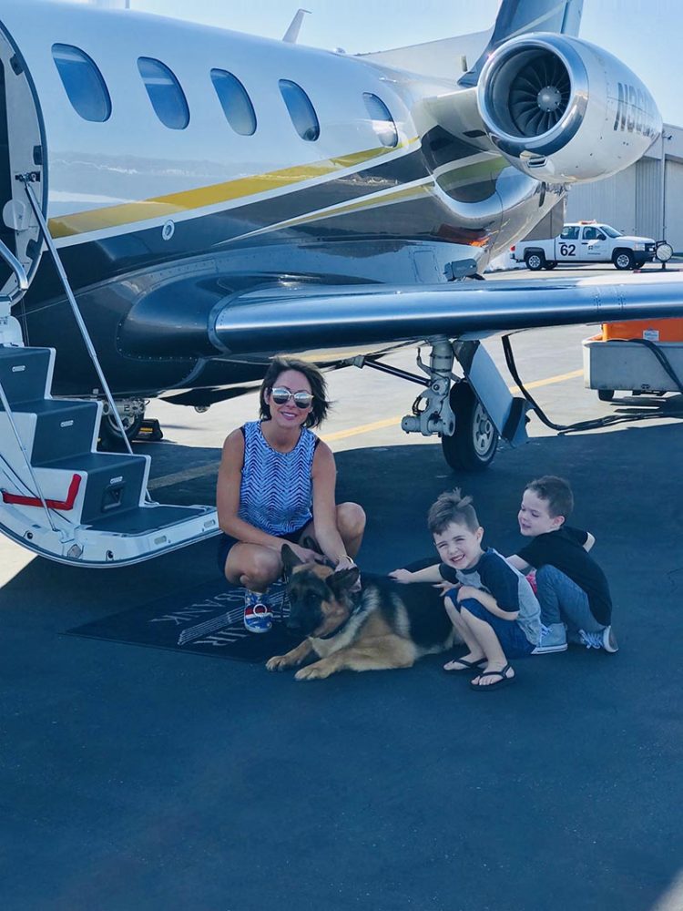 Family with German Shepherd and Plane