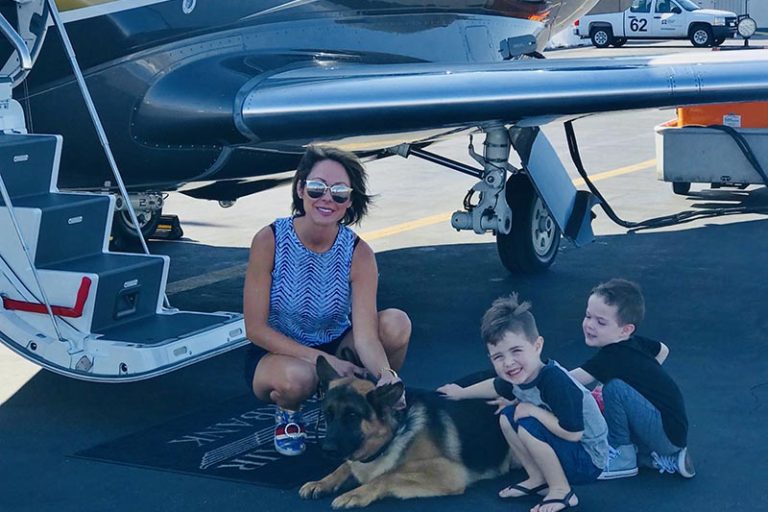 Family with German Shepherd and Plane