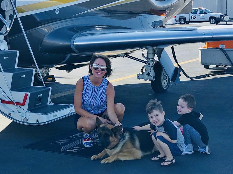 Family with German Shepherd and Plane