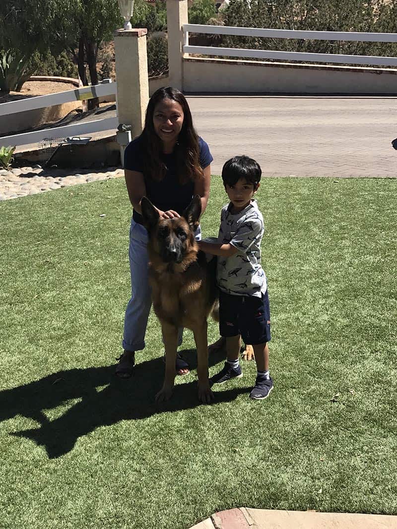 German Shepherd with woman and child