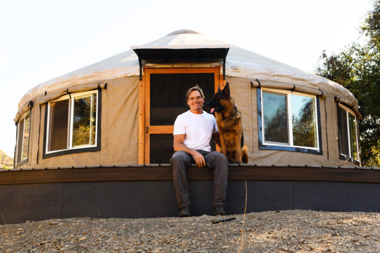 Darin Olien sitting with his dog