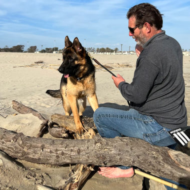 Michael Kempkes playing with Marcos at the beach