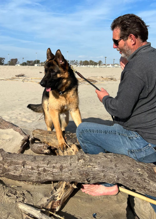 Michael Kempkes playing with Marcos at the beach