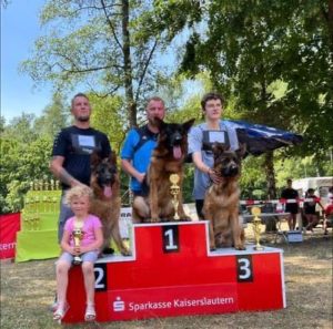 Neros champion dog on podium.